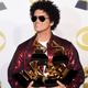 Bruno Mars poses with the five Grammys he won during the 60th annual show Jan. 28, 2018, in New York City.